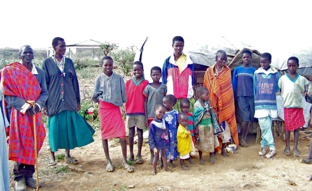 Samburu tribal family outside their makeshift hut